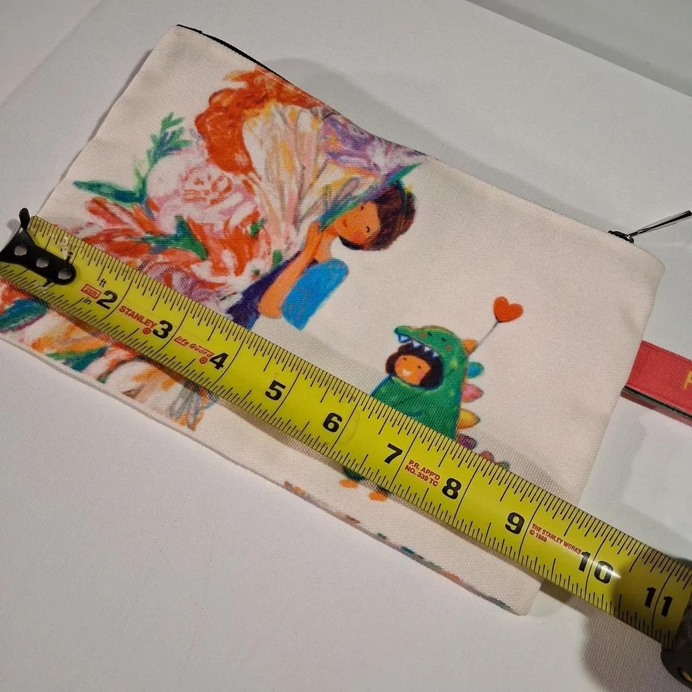 Womens Phillipines canvas pouch with graphic of a girl with a green dinosaur